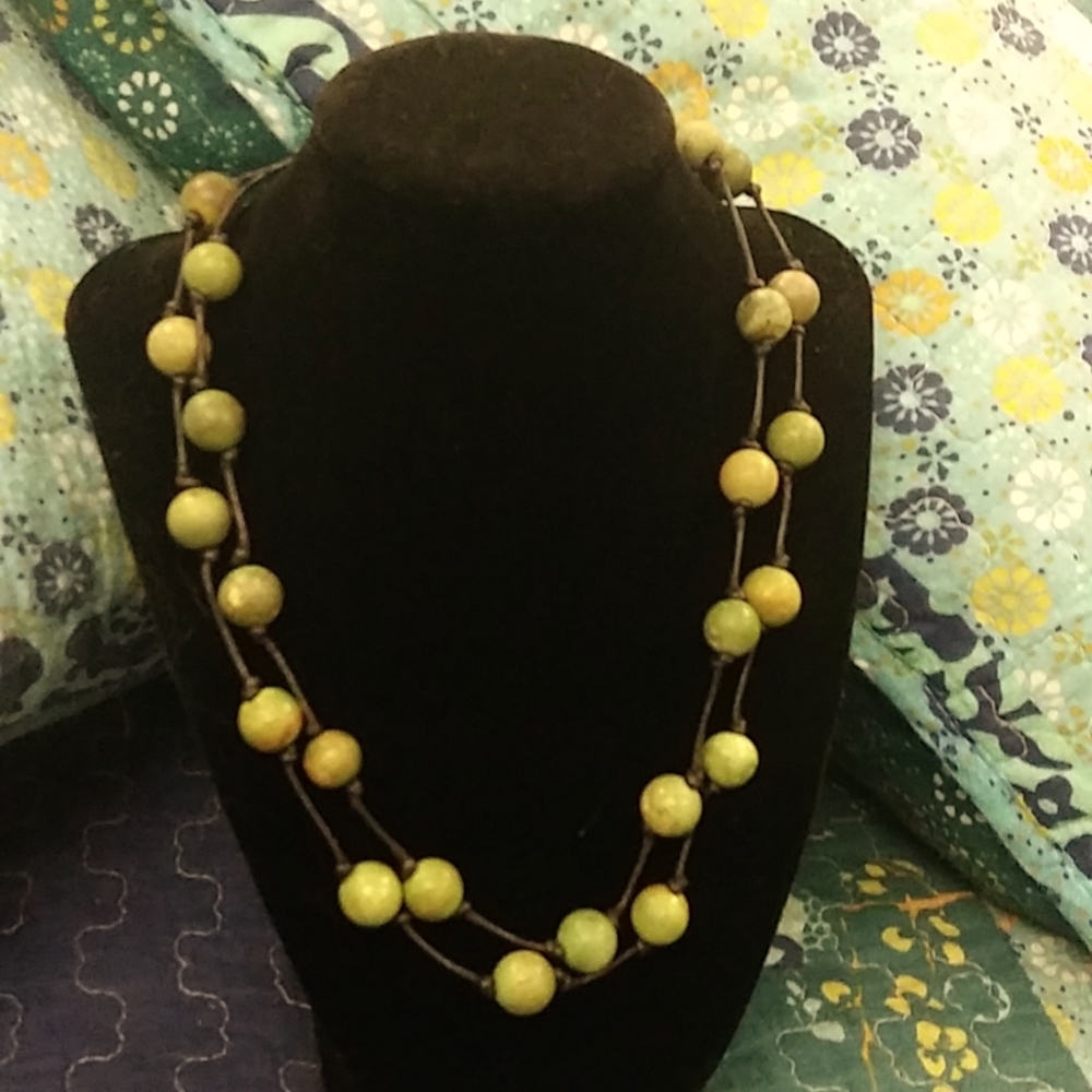 Turquoise bead and silver clasp double strand necklace.